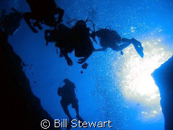 Divers ascending from the Blue Hole.  Photo taken on 8 De... by Bill Stewart 